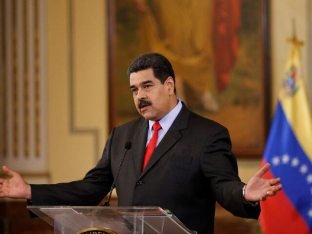 Venezuela's President Nicolas Maduro gestures as he talks to the media during a news conference in Caracas